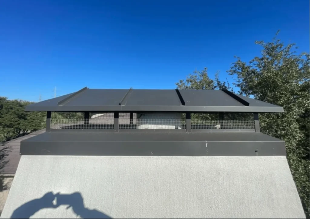 Close-up view of a chimney cap atop a chimney, ensuring safe and efficient airflow