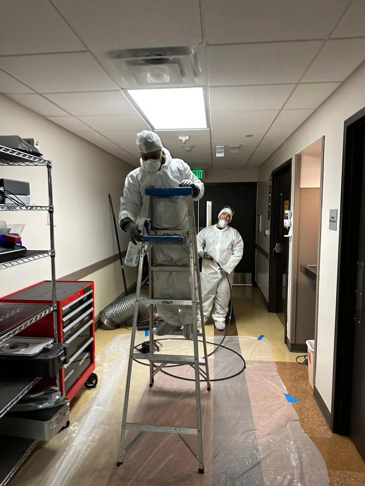 Technicians performing commercial air duct cleaning