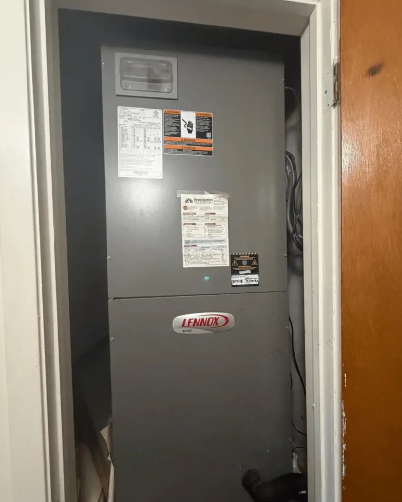 Lennox air handler unit installed inside a residential HVAC closet