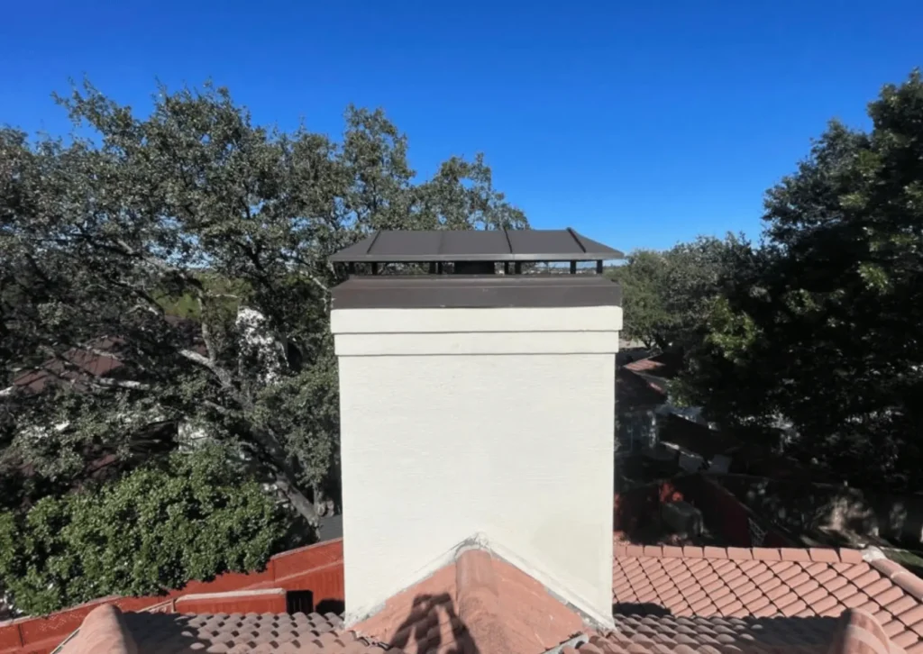 New chimney cap installed on a residential chimney for improved protection and ventilation