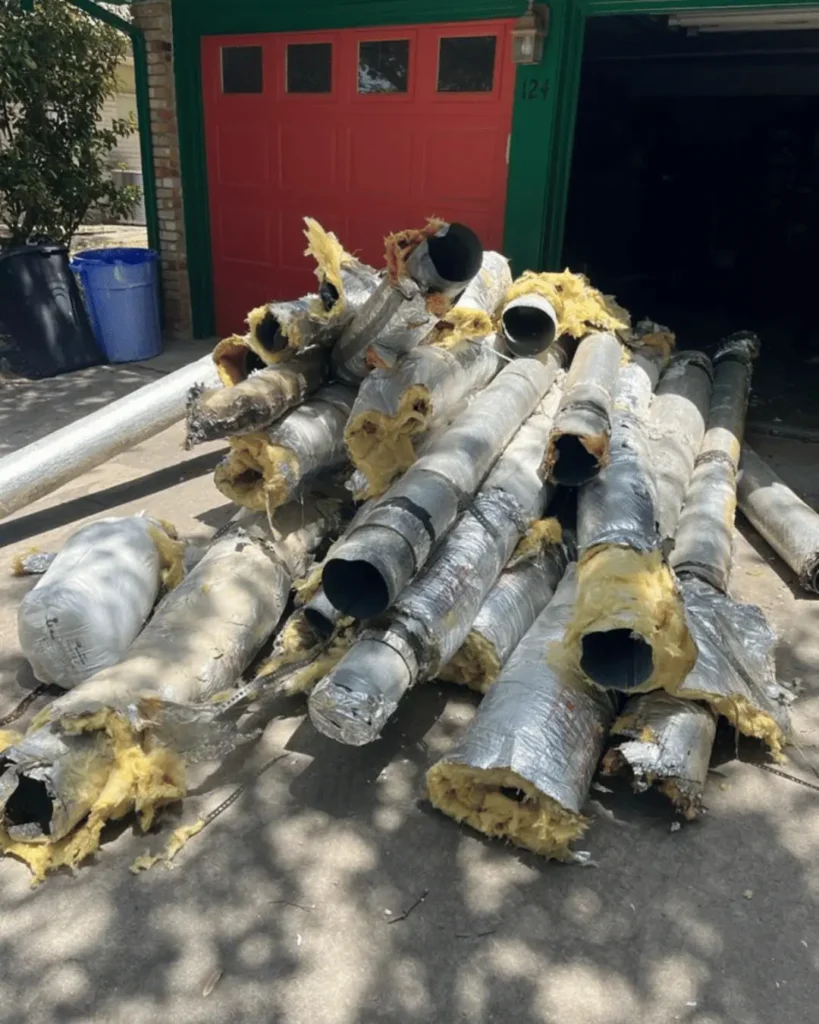 Old insulated air ducts removed from home during HVAC replacement project